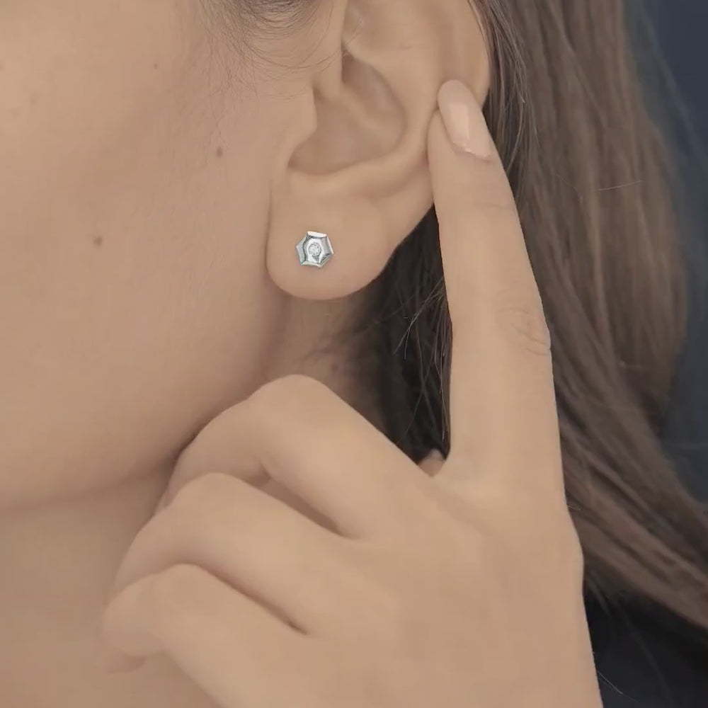 Geometric cube solitaire stud earrings with hexagonal frame and round centre stone