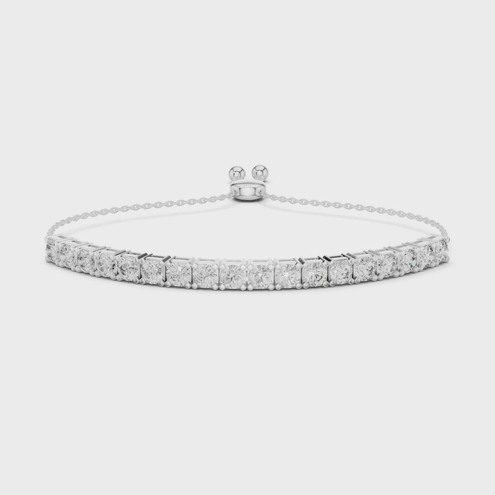 Tennis adjustable slider bracelet with prong set round stone row detailing