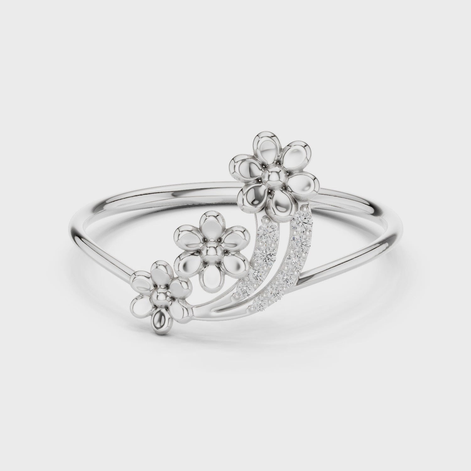 Ladies silver floral cluster ring with three flower motifs and diamond-studded arc