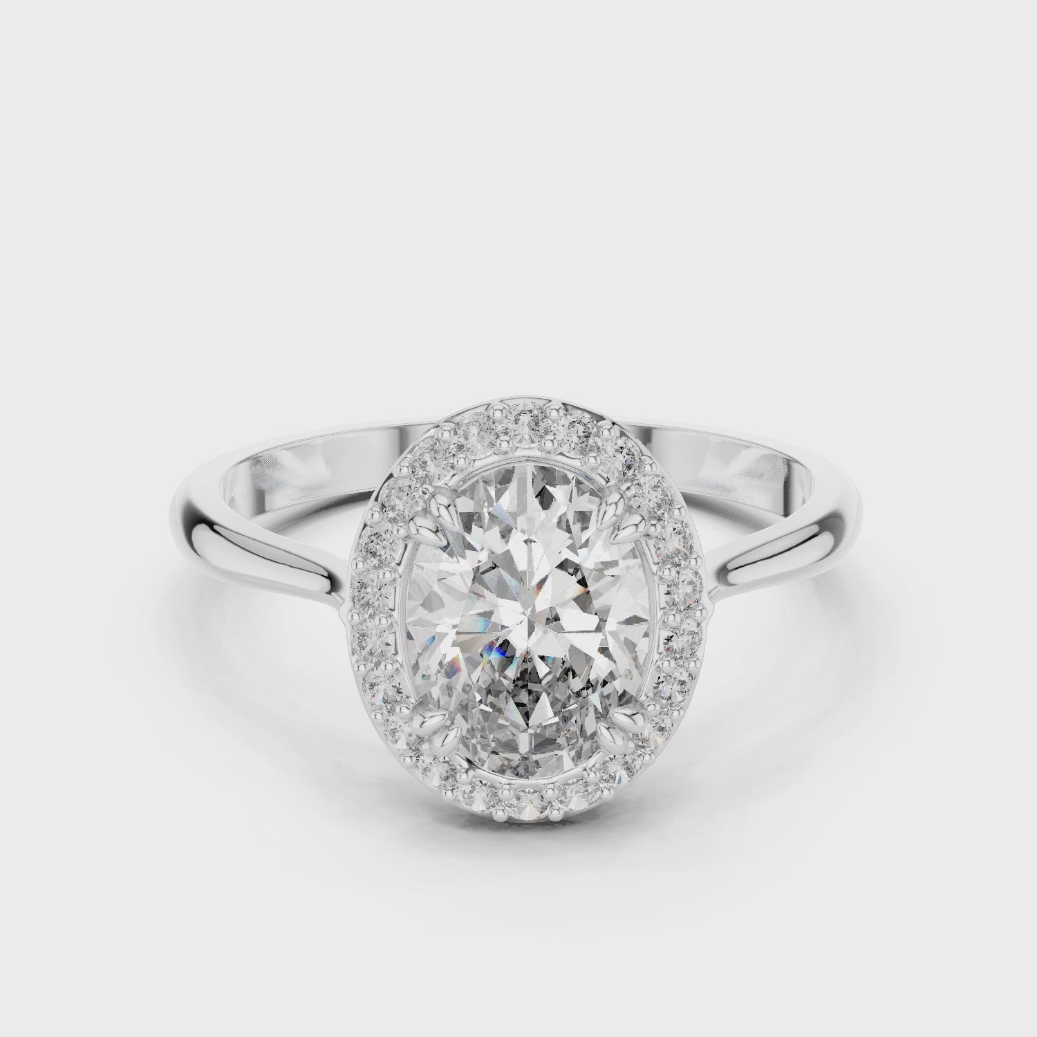 Oval halo solitaire engagement ring with pave surround and plain split shoulder band
