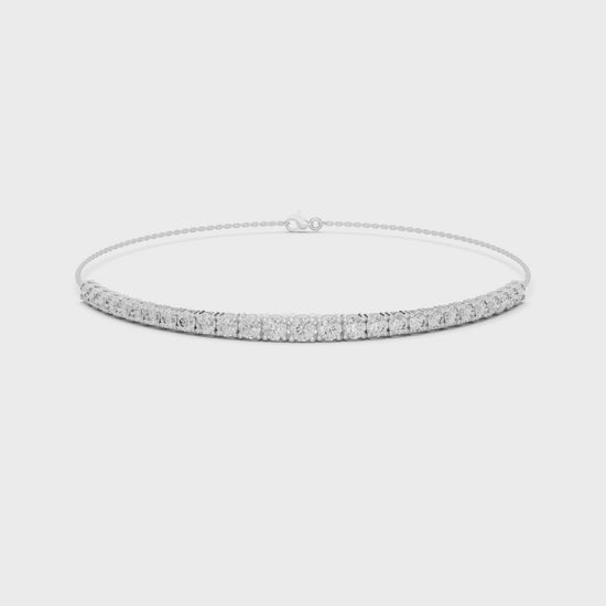 Graduating tennis chain bracelet with prong set round stone row detailing
