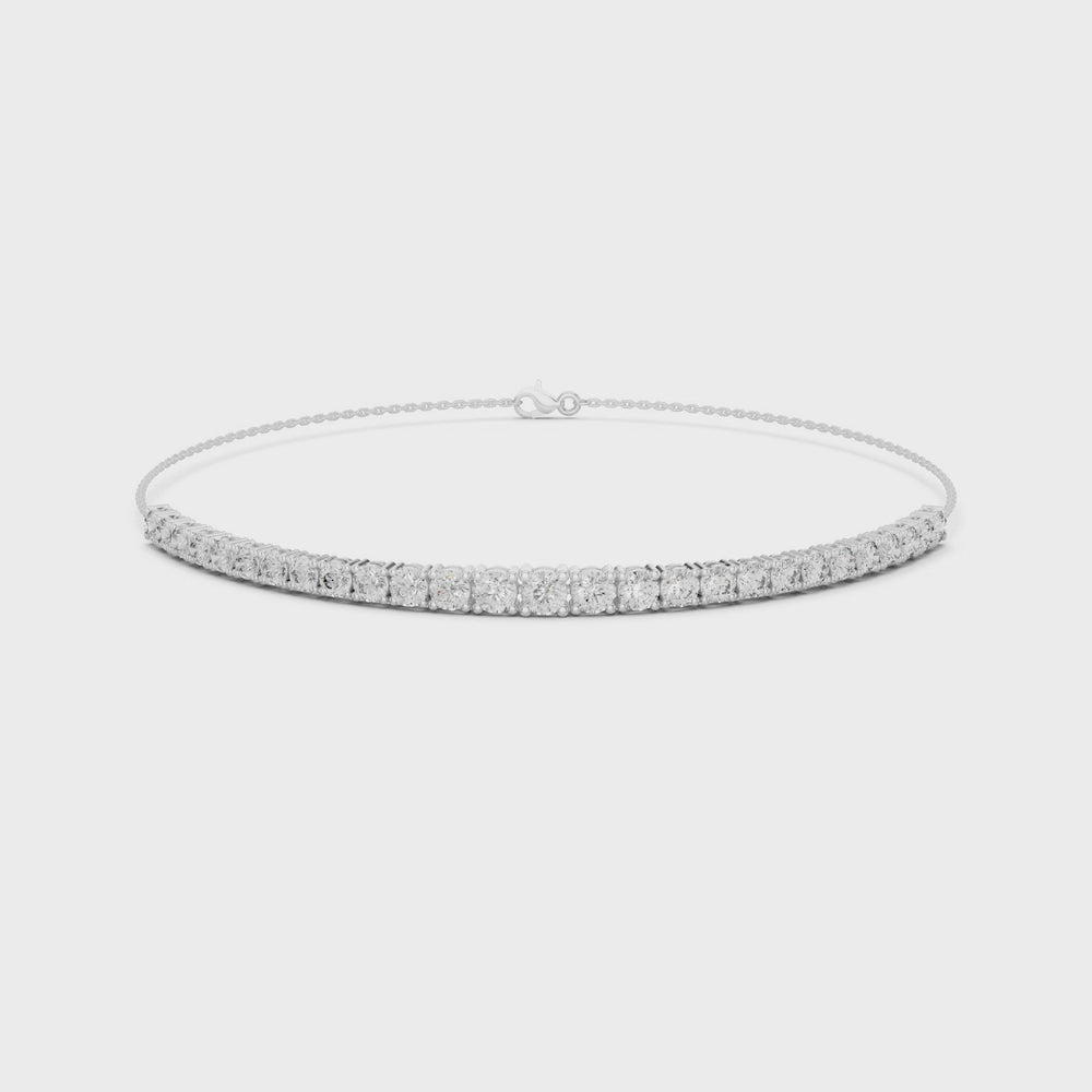 Graduating tennis chain bracelet with prong set round stone row detailing