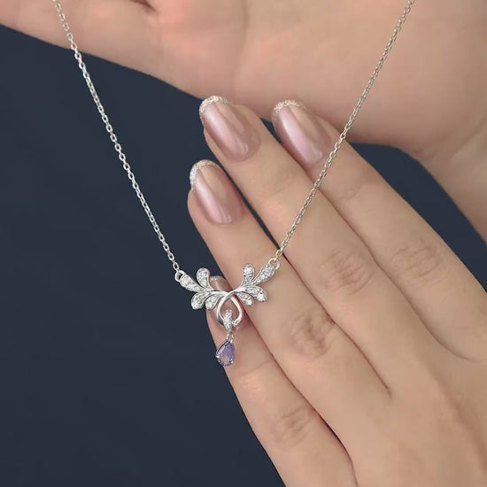 Elegant floral pendant necklace with a purple teardrop stone