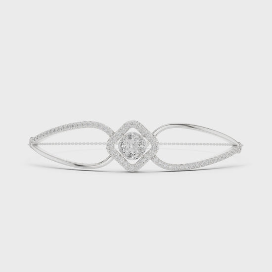 Elegant silver cuff bracelet featuring geometric diamond cluster center with sparkling pavé stones