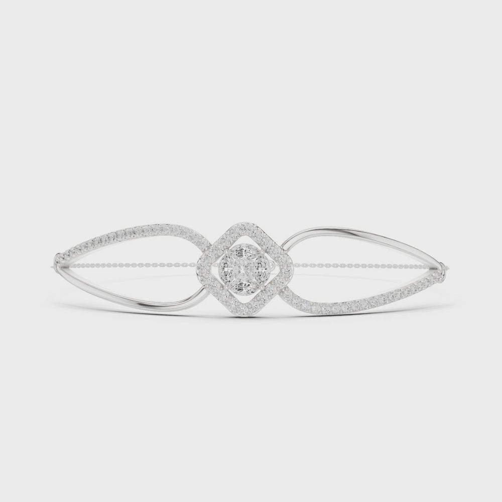 Elegant silver cuff bracelet featuring geometric diamond cluster center with sparkling pavé stones