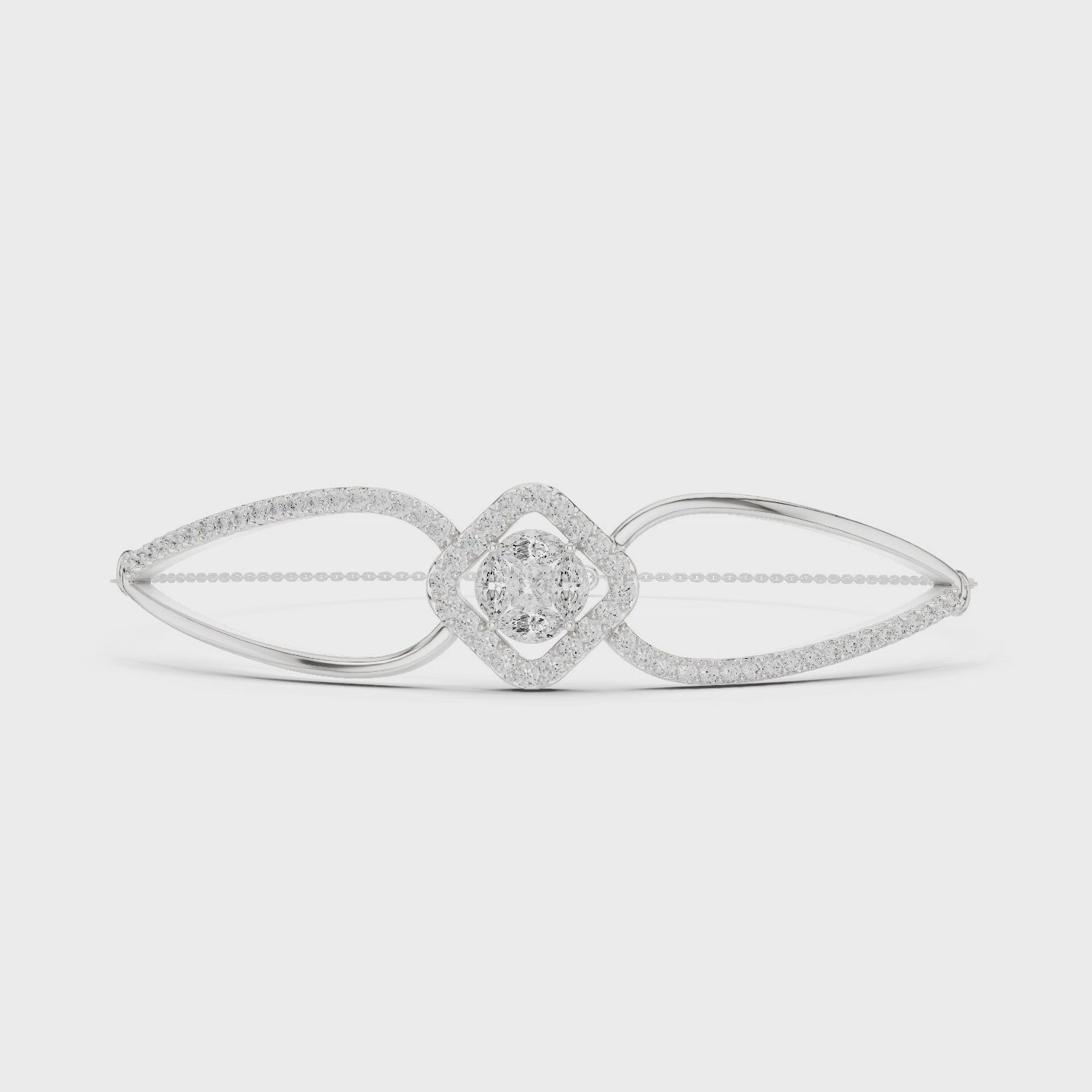 Elegant silver cuff bracelet featuring geometric diamond cluster center with sparkling pavé stones