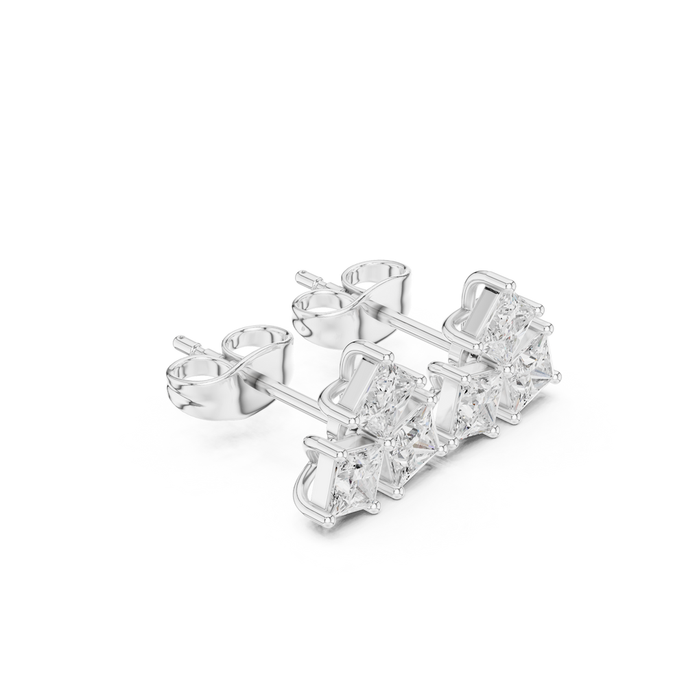 Princess cut trio cluster stud earrings with three prong set princess cut stones arranged in a triangular cluster