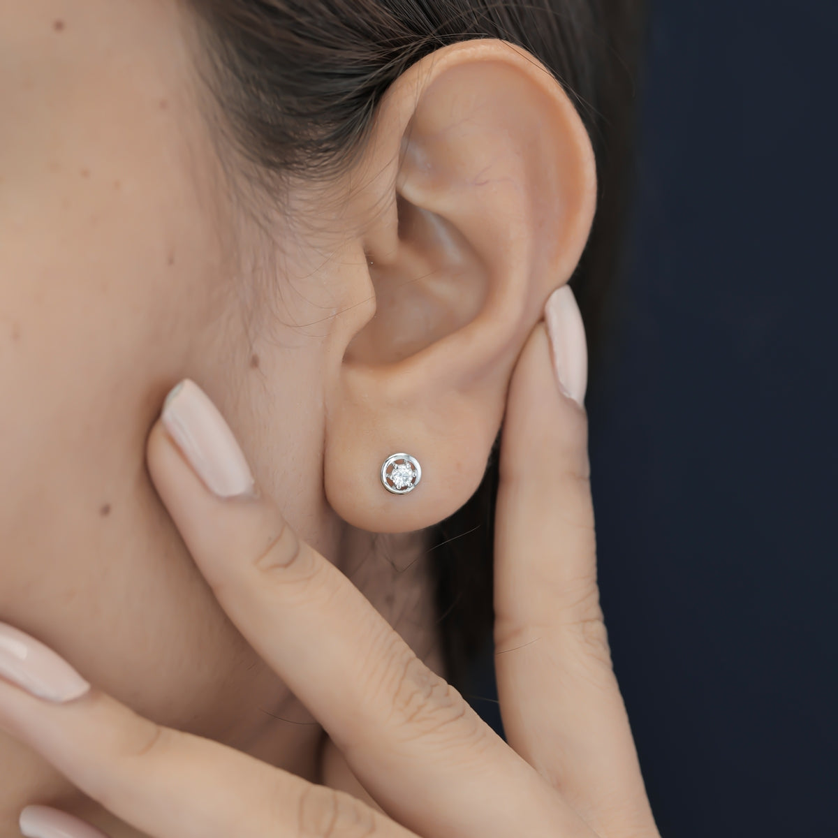 Round halo stud earrings with six claw raised centre and circular border