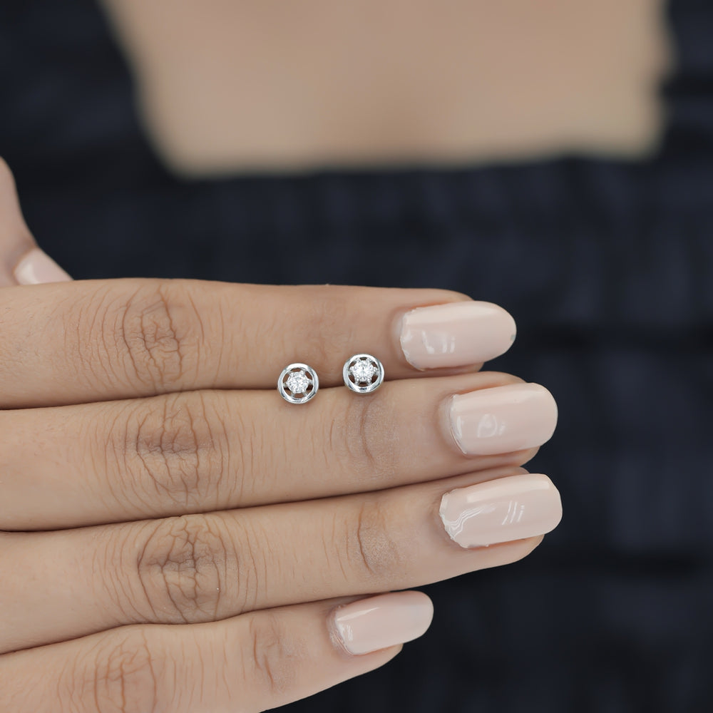 Round halo stud earrings with six claw raised centre and circular border