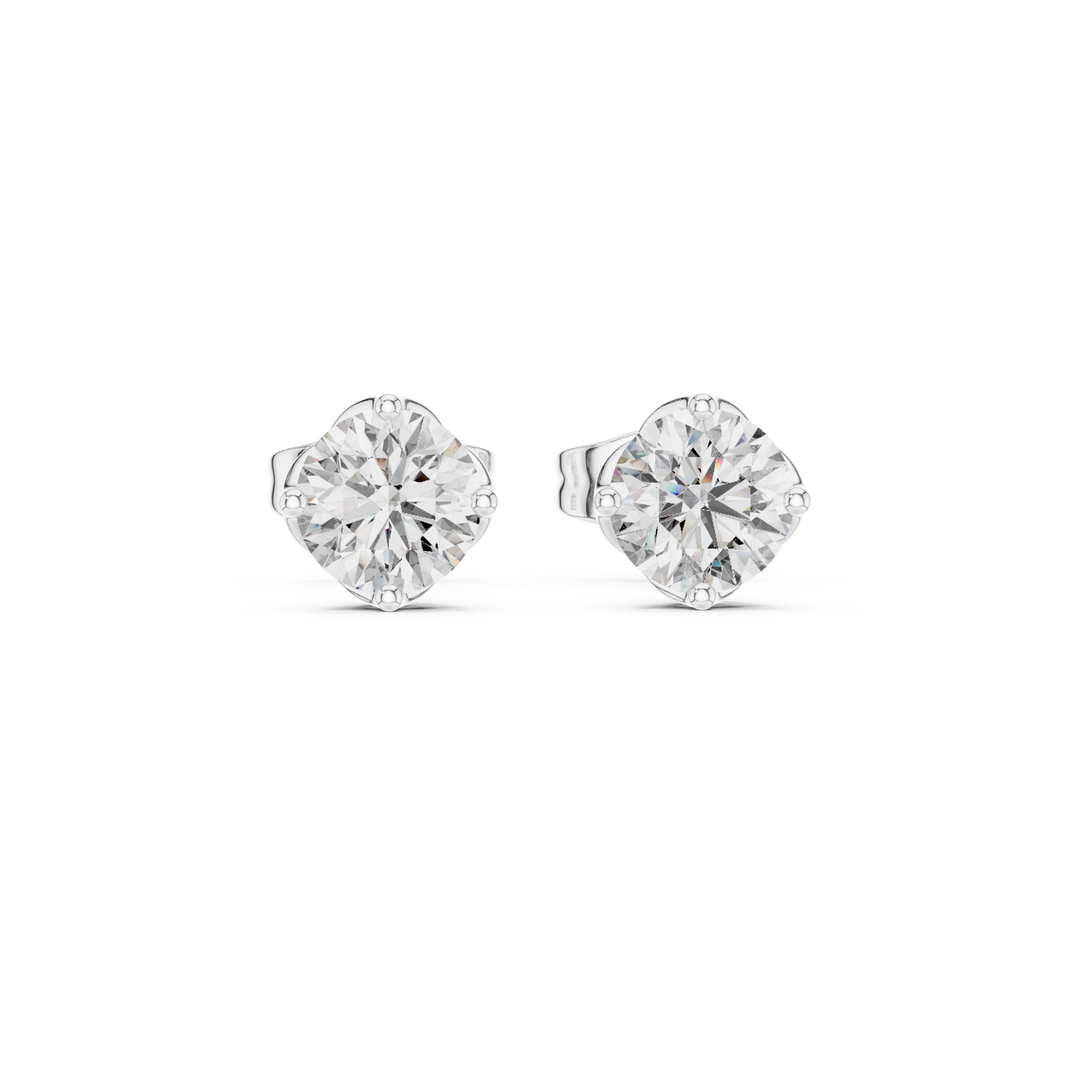 Round solitaire four prong stud earrings with large brilliant round centre stone