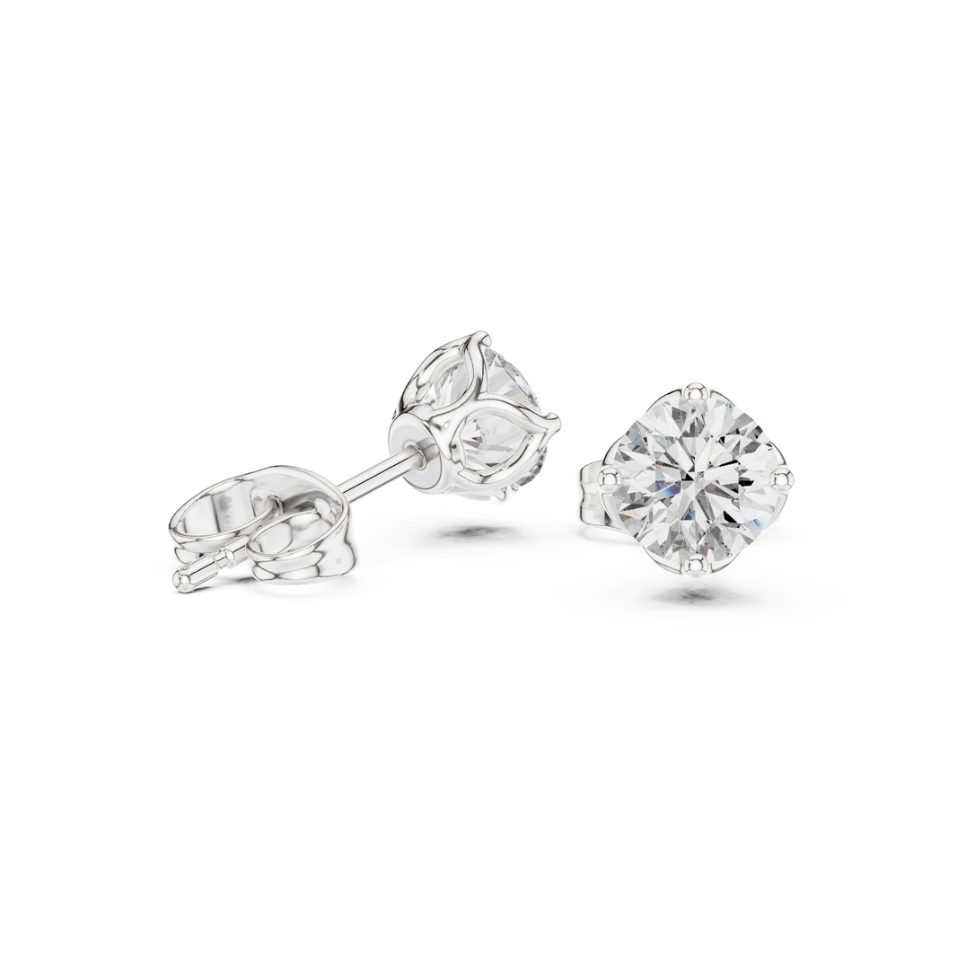 Round solitaire four prong stud earrings with large brilliant round centre stone