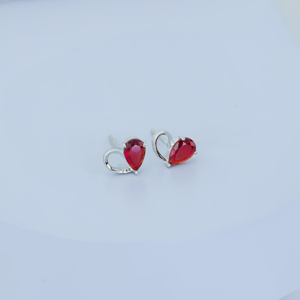 Ruby red heart loop stud earrings with open teardrop swirl base and pear stone top