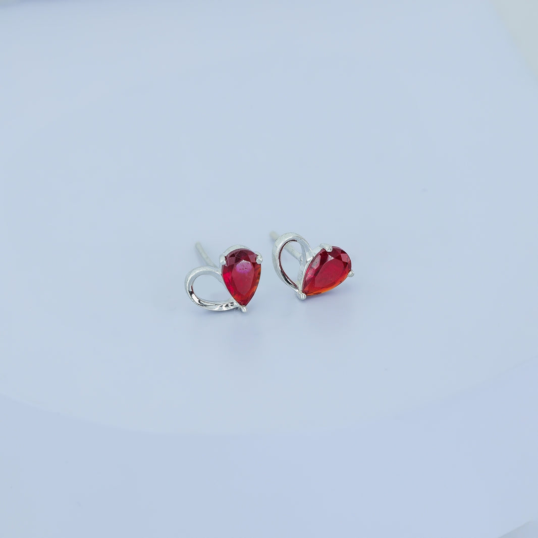 Ruby red heart loop stud earrings with open teardrop swirl base and pear stone top