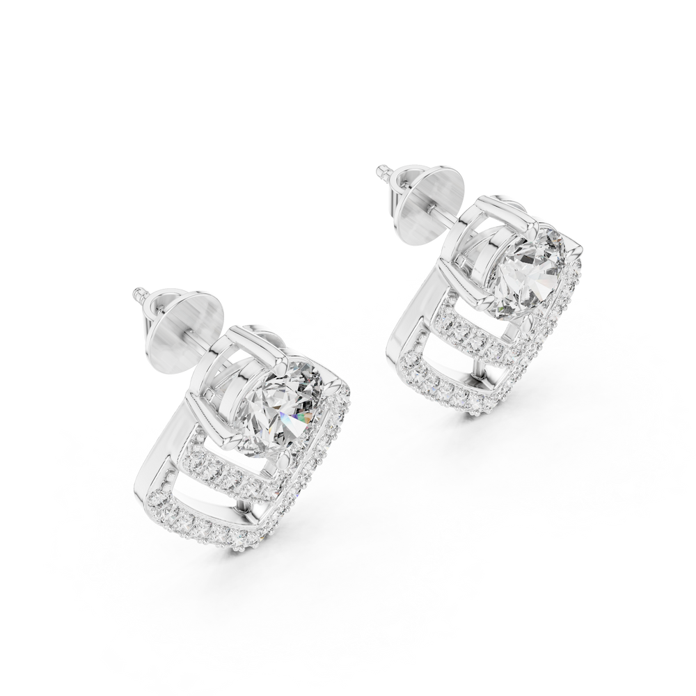 Prong-set round brilliant solitaire stud earrings with a double stone-set chevron drop jacket below