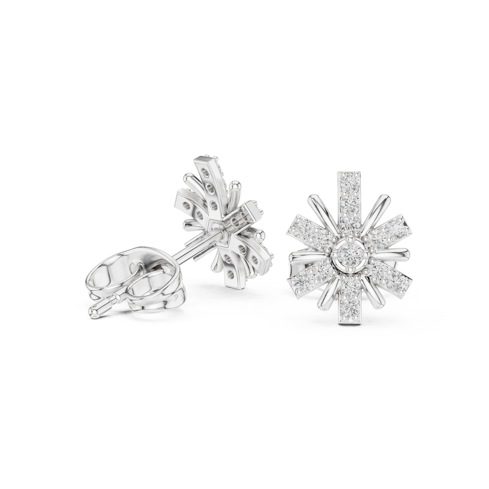 Starburst stud earrings with a bezel-set solitaire centre, pavé-set radiating arms and polished spike accents