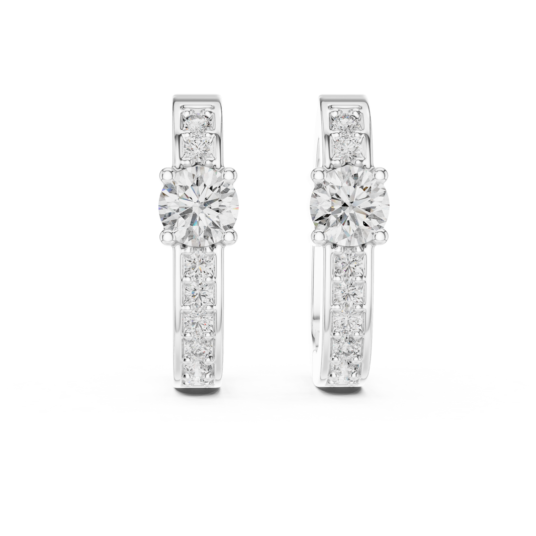 Solitaire station huggie earrings with stone set band and large prong set round solitaire centre stone