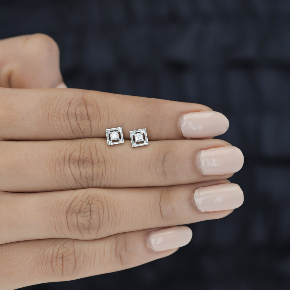 Square claw stud earrings with tilted open frame and raised round centre