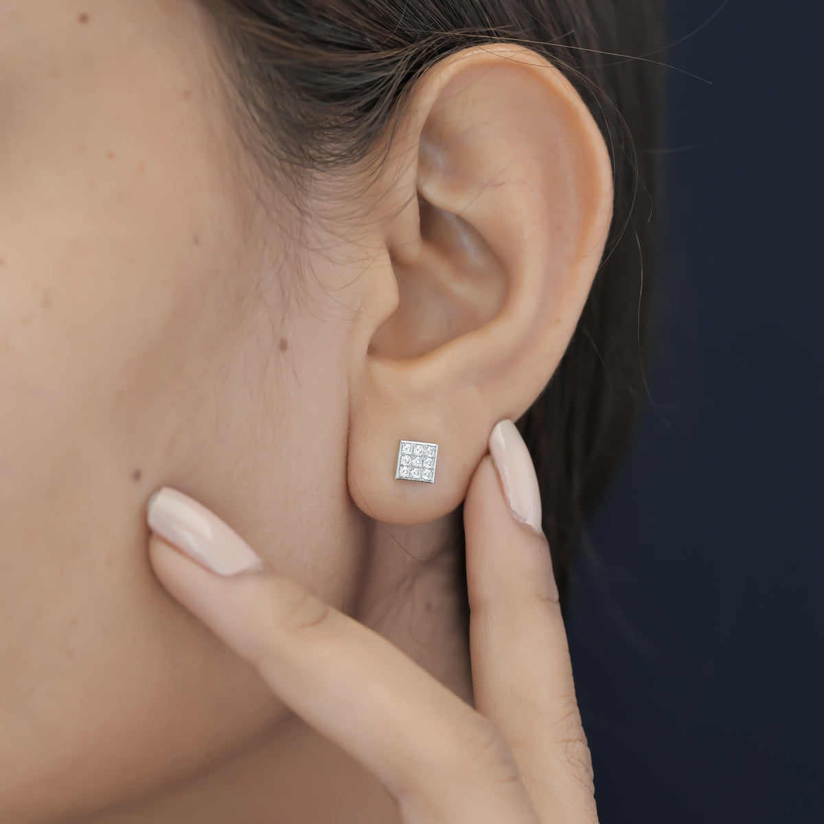 Square grid cluster stud earrings with tilted diamond shape and pave filled surface