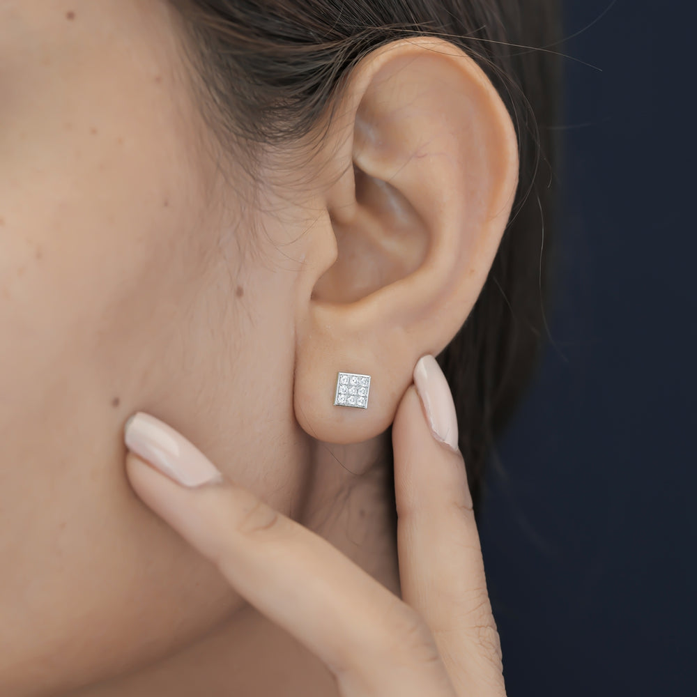 Square grid cluster stud earrings with tilted diamond shape and pave filled surface