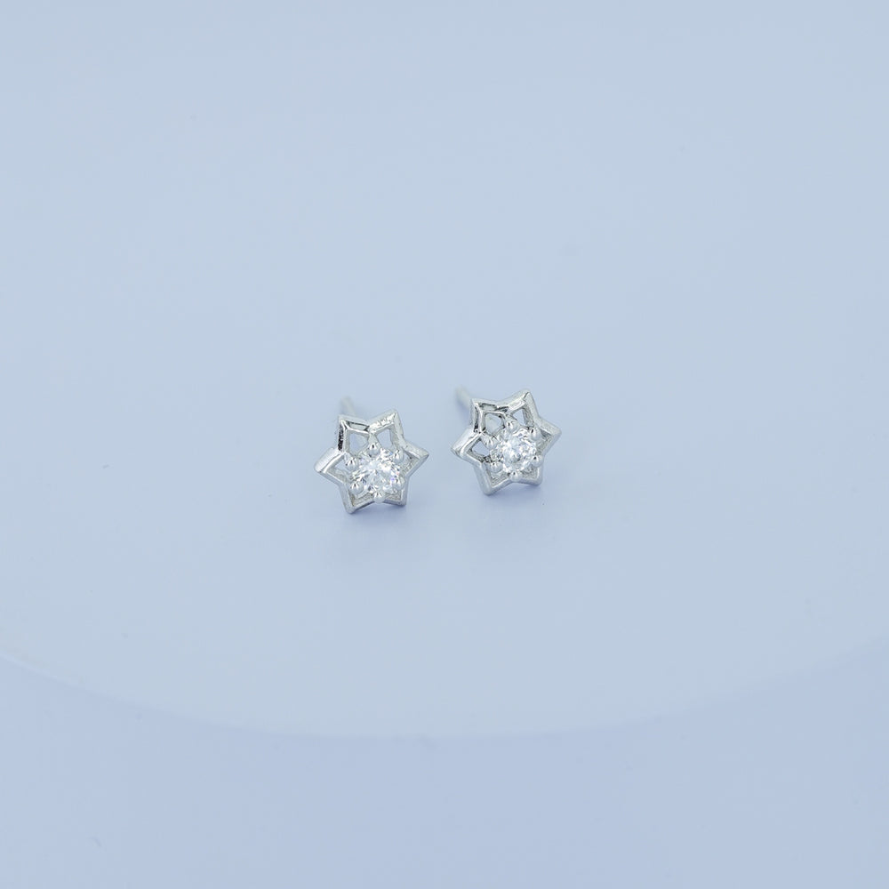 Star burst stud earrings with pointed geometric frame and raised centre