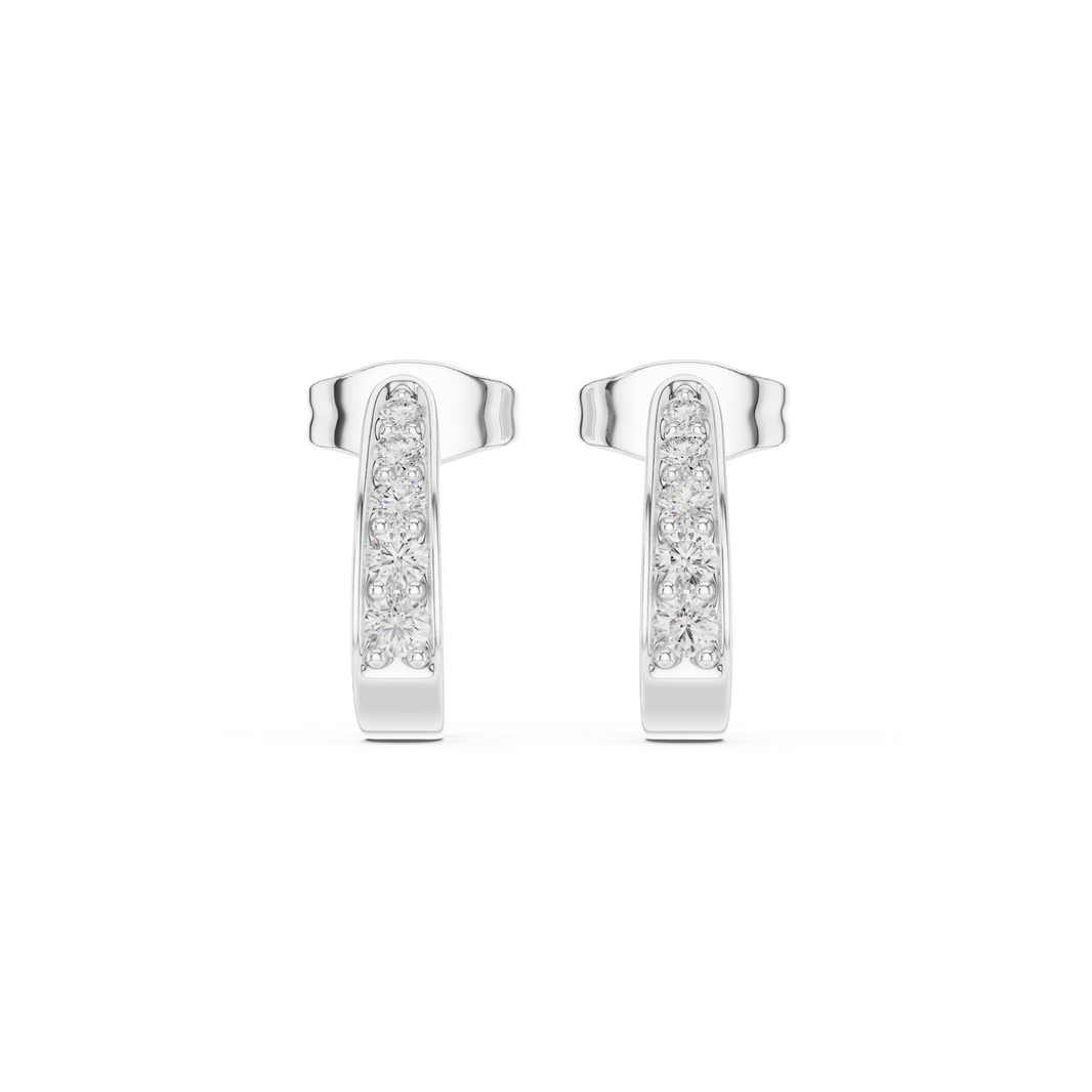 J-shaped huggie earrings with a single row of round brilliant stones along the outer curved band