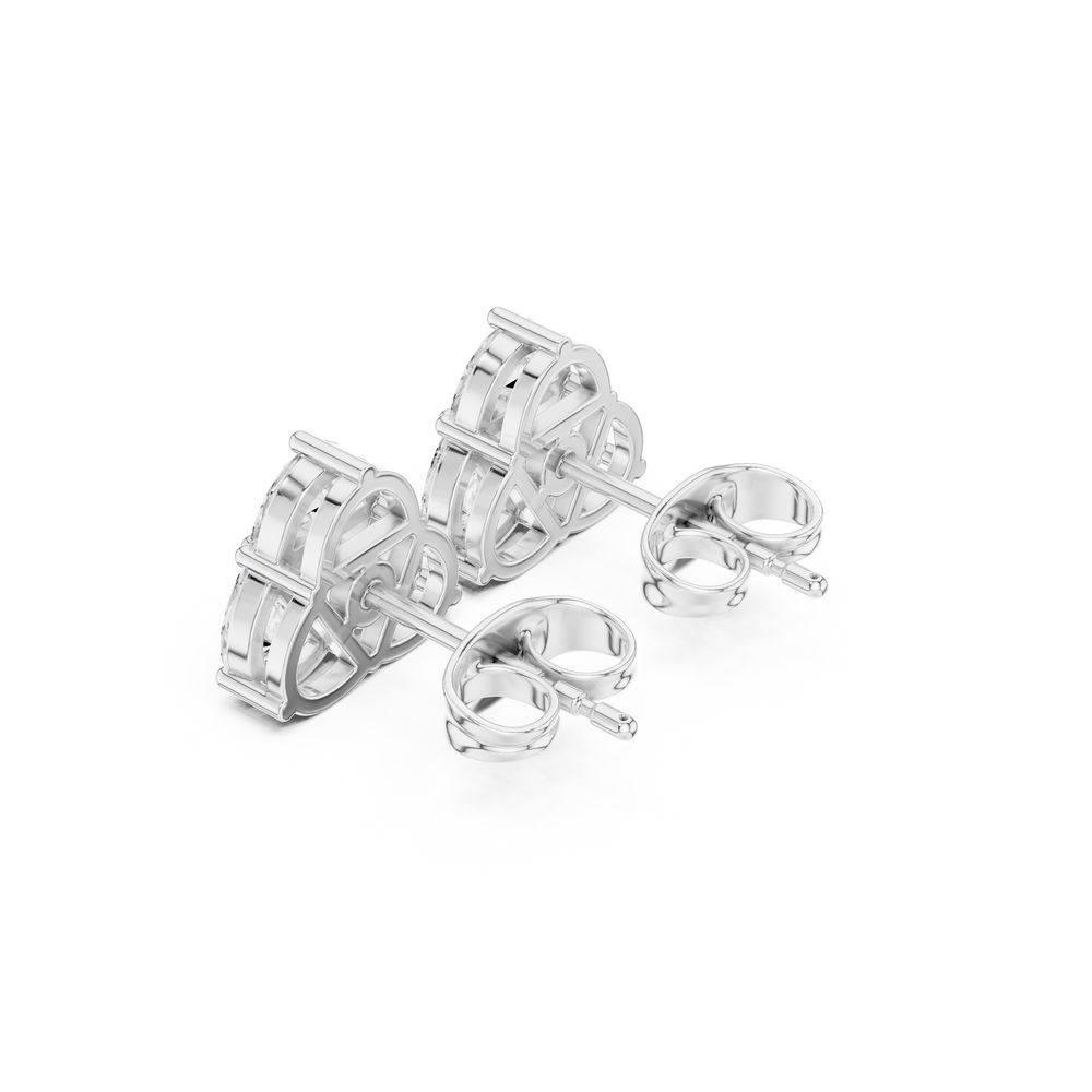 Three pear-shaped stones arranged in a triangular cluster stud earring