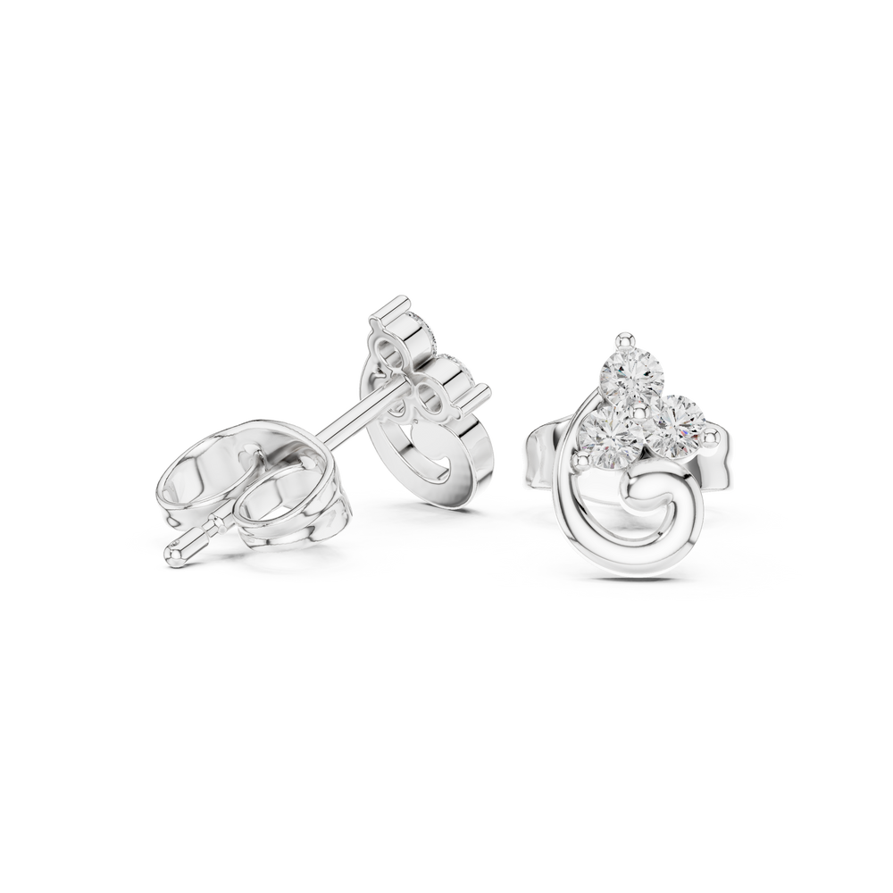 Three-stone round brilliant prong-set stud earrings with a polished swirl curl detail below the cluster setting