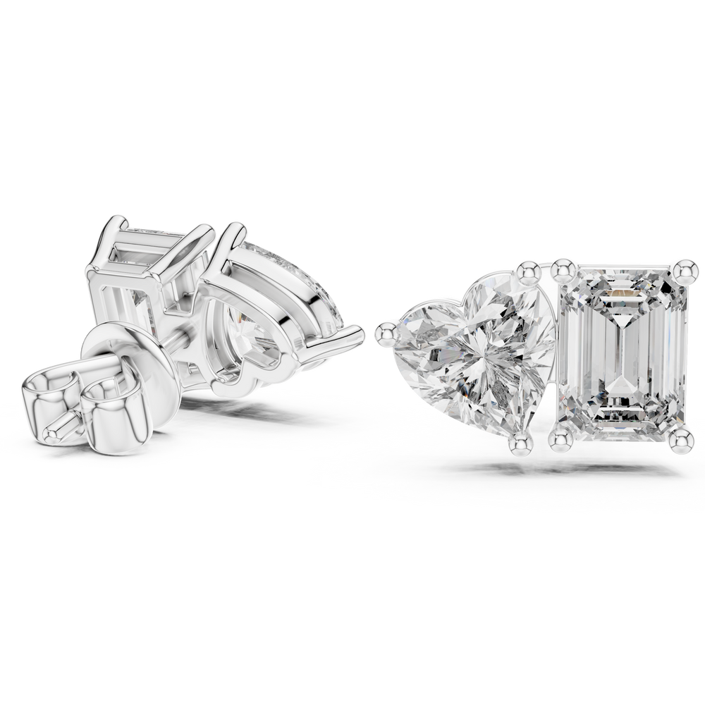 Toi et moi stud earrings with side by side emerald cut and heart shaped stones in prong setting