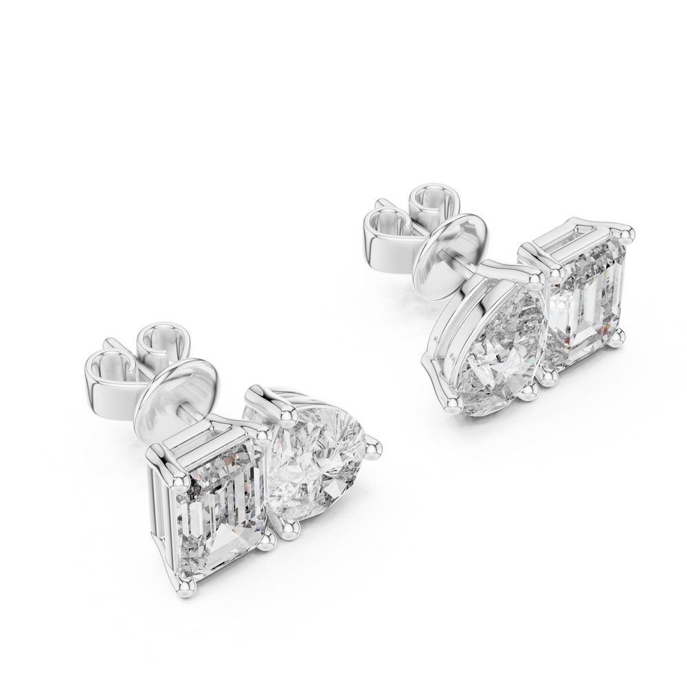 Toi et moi stud earrings with side by side emerald cut and pear shaped stones in prong setting