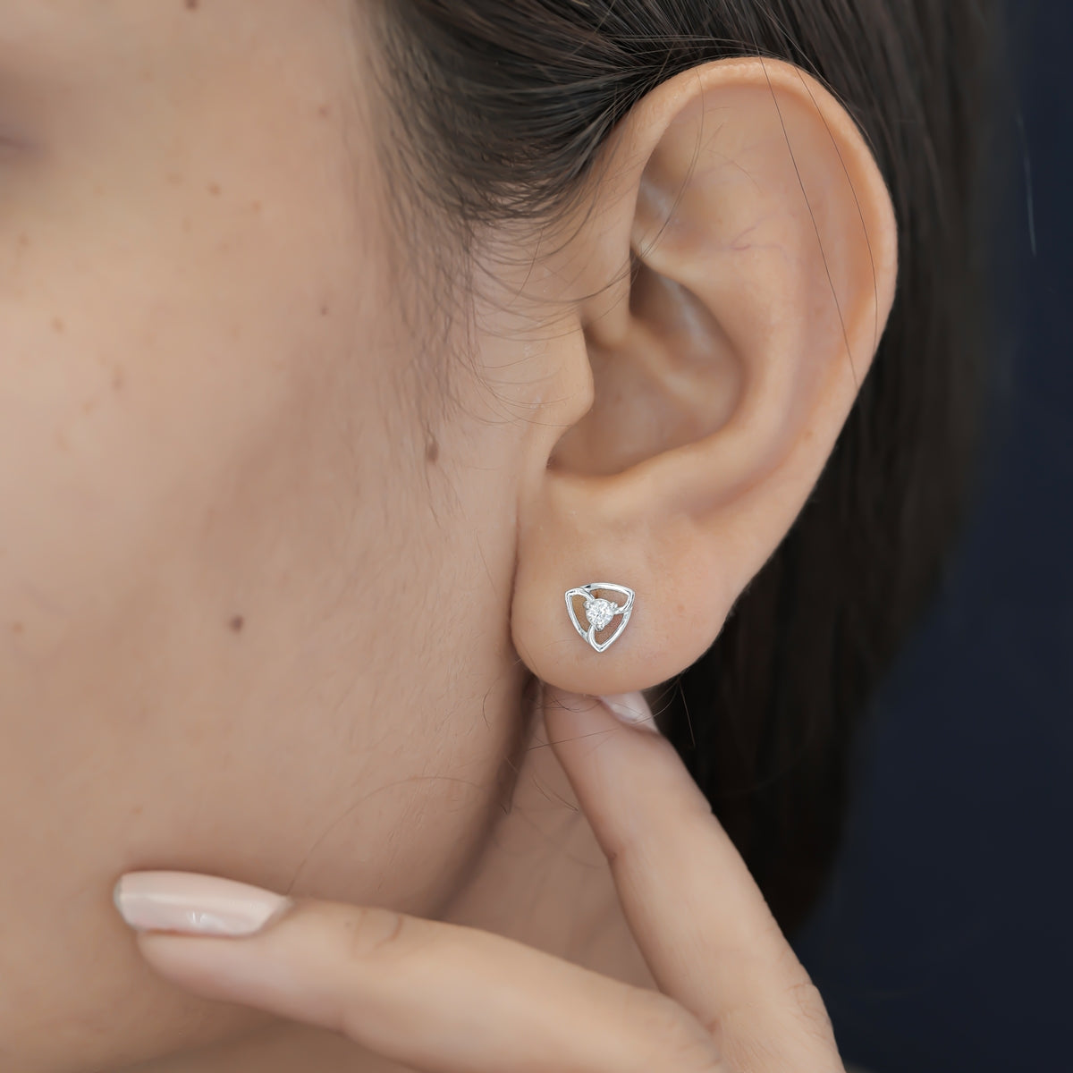 Tribhuj stud earrings with open triangular frame and round centre stone