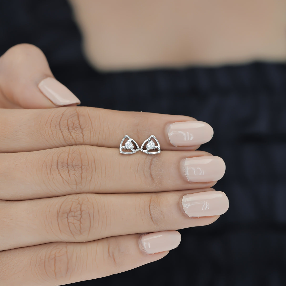 Tribhuj stud earrings with open triangular frame and round centre stone